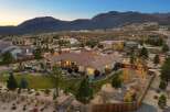 Experience luxury living in this stunning single-story home, nestled against a breathtaking mountain backdrop.