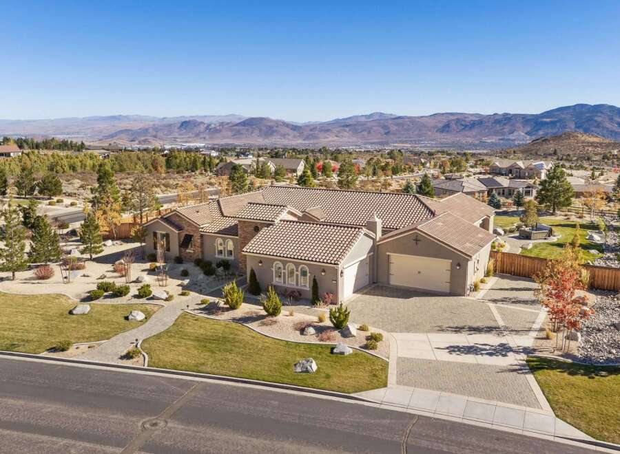 Discover this stunning single-story home with a tile roof, offering a spacious 3-car garage and elegant stone accents.