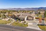 Discover this stunning single-story home with a tile roof, offering a spacious 3-car garage and elegant stone accents.