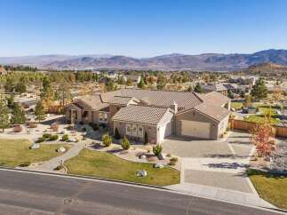 Discover this stunning single-story home with a tile roof, offering a spacious 3-car garage and elegant stone accents.