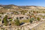 Experience luxury living in this stunning single-story home, nestled against a backdrop of majestic mountains.