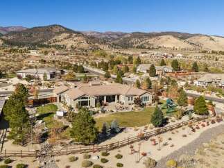 Experience luxury living in this stunning single-story home, nestled against a backdrop of majestic mountains.
