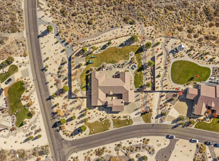 Experience luxury living in this stunning aerial view of a sprawling estate.