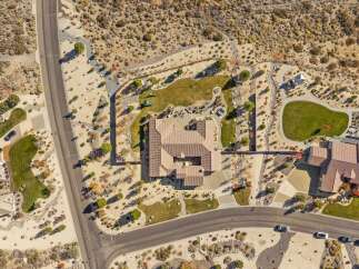 Experience luxury living in this stunning aerial view of a sprawling estate.