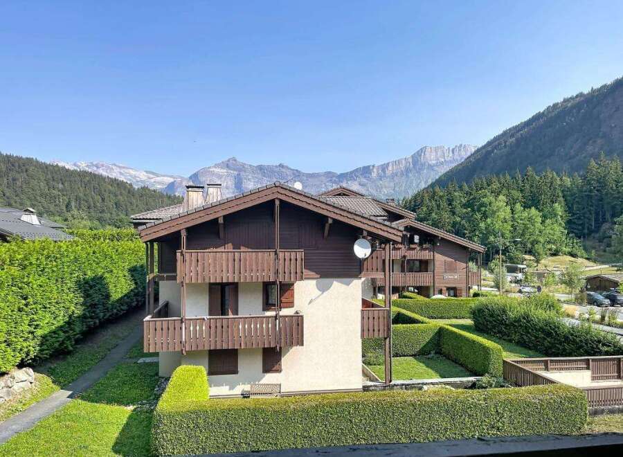 Experience mountain living in this charming property featuring traditional alpine architecture with rich wooden accents and multiple balconies offering stunning views.