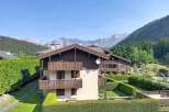 Experience mountain living in this charming property featuring traditional alpine architecture with rich wooden accents and multiple balconies offering stunning views.