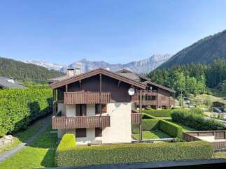 Experience mountain living in this charming property featuring traditional alpine architecture with rich wooden accents and multiple balconies offering stunning views.