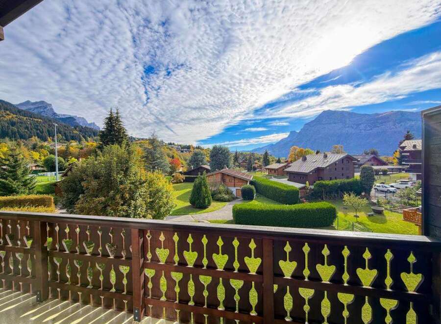 Enjoy breathtaking mountain views from this charming chalet-style home, perfect for a serene getaway.