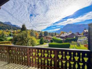 Enjoy breathtaking mountain views from this charming chalet-style home, perfect for a serene getaway.