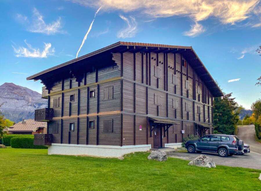 Experience alpine living in this charming wooden chalet, boasting multiple levels and balconies perfect for enjoying mountain views.