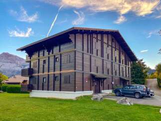 Experience alpine living in this charming wooden chalet, boasting multiple levels and balconies perfect for enjoying mountain views.