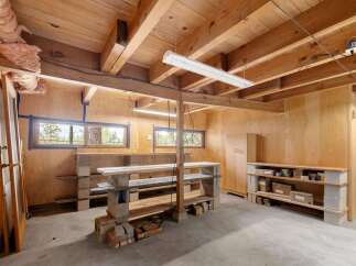 Discover a versatile workshop space with ample storage solutions, perfect for your next project.