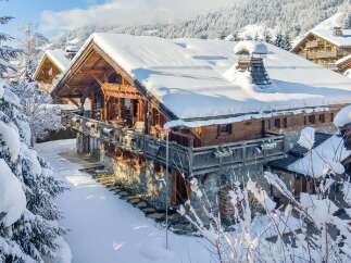 Experience the ultimate winter wonderland in this stunning chalet, nestled amidst snow-covered mountains.