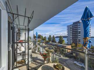 Enjoy breathtaking water views from this spacious balcony, perfect for relaxing or entertaining.