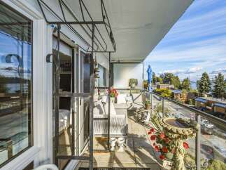 Enjoy breathtaking water and city views from this spacious balcony, perfect for relaxing or entertaining.