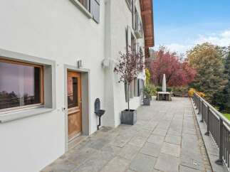 Experience outdoor living at its finest on this expansive stone patio, perfect for entertaining or quiet relaxation.