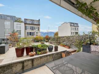 Enjoy breathtaking mountain views from this expansive rooftop terrace, perfect for entertaining or quiet relaxation.