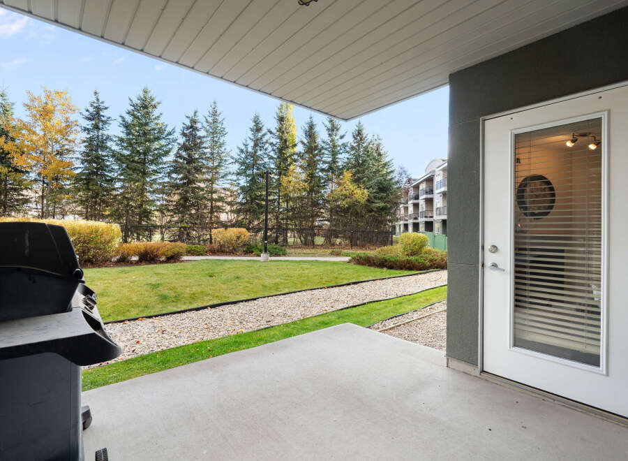 Enjoy outdoor living on this spacious patio, complete with a grill for your summer cookouts.