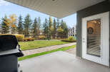 Enjoy outdoor living on this spacious patio, complete with a grill for your summer cookouts.