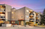 Experience modern living in this stunning apartment building, featuring spacious balconies perfect for enjoying the twilight sky.