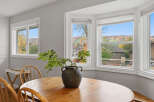 Enjoy breathtaking autumn views from this charming dining area, featuring a large bay window that floods the space with natural light.