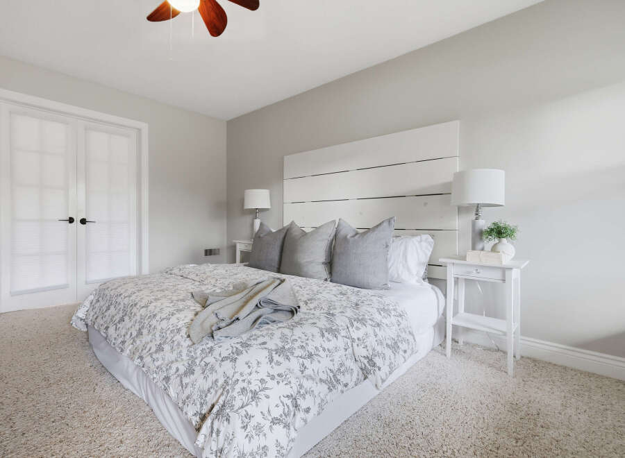 Step into this serene master bedroom, featuring a plush, neutral-toned carpet that invites relaxation.