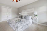 Step into this serene master bedroom, featuring a plush, neutral-toned carpet that invites relaxation.