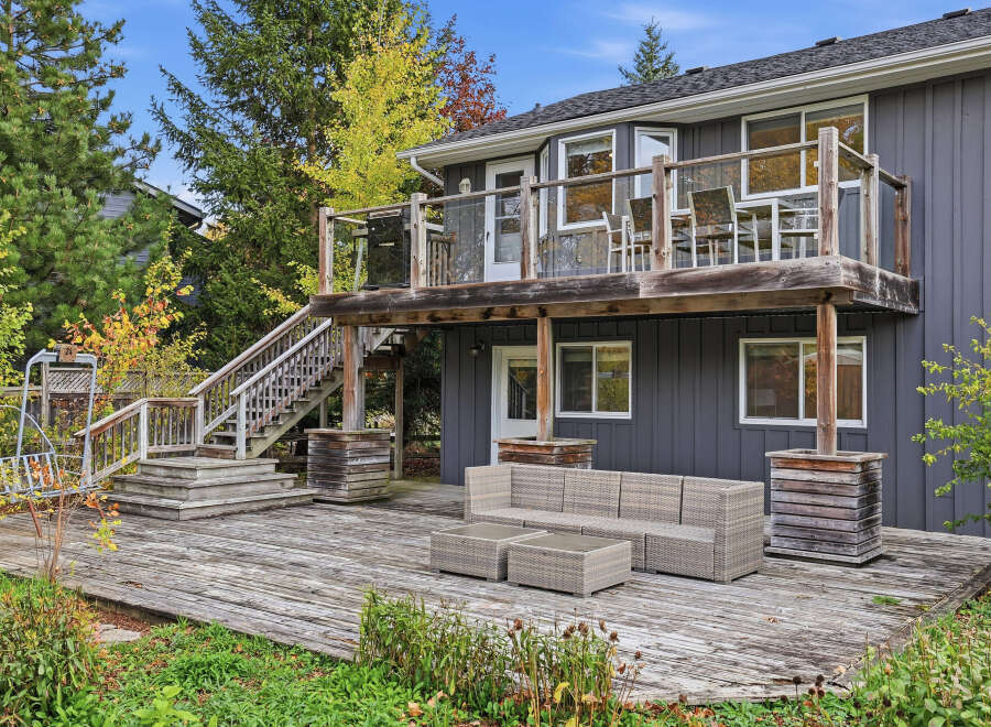 Enjoy outdoor living with this expansive multi-level deck, perfect for entertaining or relaxing.