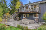 Enjoy outdoor living with this expansive multi-level deck, perfect for entertaining or relaxing.
