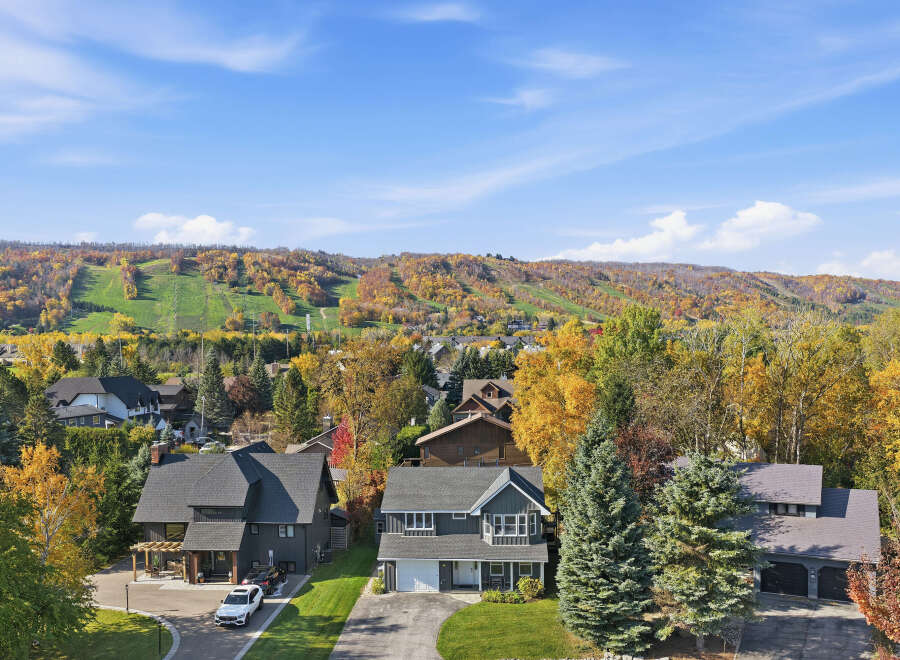 Experience the beauty of autumn from this stunning property, nestled amidst vibrant fall foliage.