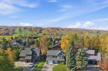 Experience the beauty of autumn from this stunning property, nestled amidst vibrant fall foliage.