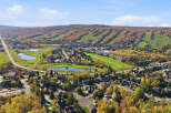 Experience the beauty of autumn in this stunning aerial view of a golf course community.