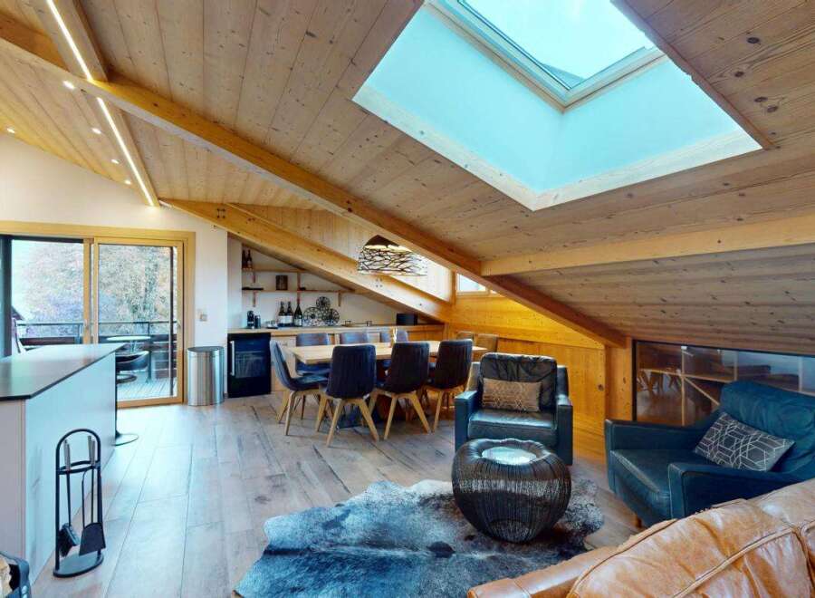 Experience modern living in this stunning attic apartment, featuring a spacious open-plan kitchen and dining area perfect for entertaining.