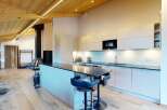 Experience modern living in this stunning open-plan space, featuring a sleek, contemporary kitchen with ample counter space and integrated appliances.