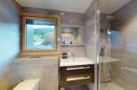 Experience modern comfort in this beautifully appointed bathroom, featuring a sleek vanity with ample storage and a spacious walk-in shower.
