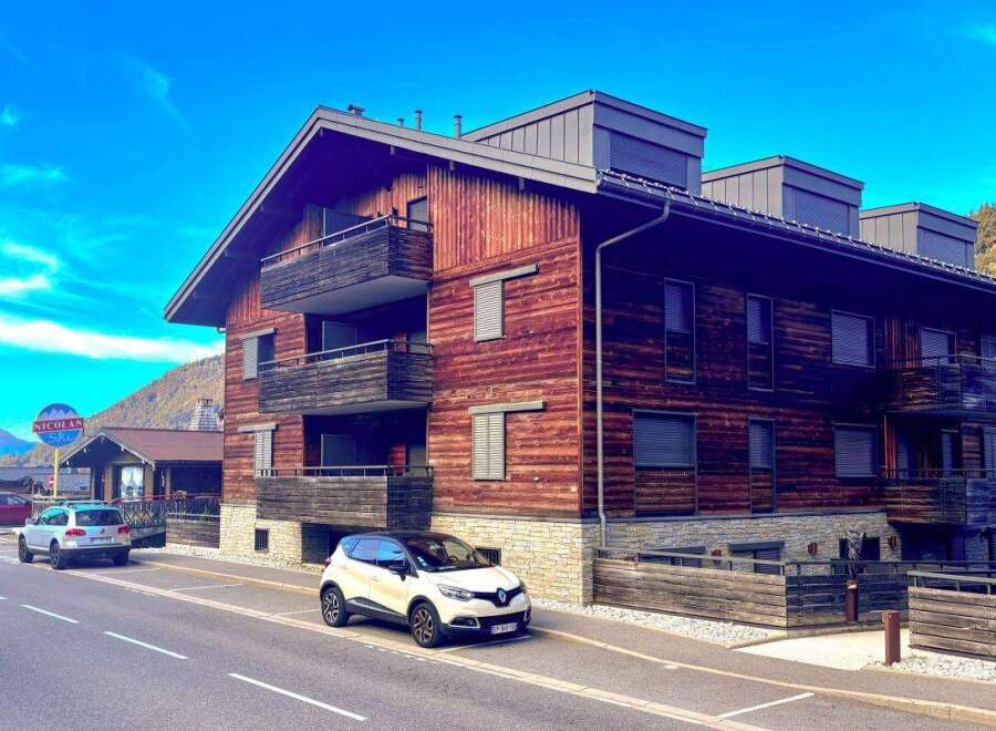 Experience alpine living in this charming wooden chalet, featuring multiple balconies perfect for enjoying mountain views.