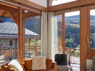 Experience luxury mountain living in this stunning chalet-style living room.