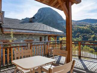 Enjoy breathtaking mountain views from this charming chalet's private balcony.