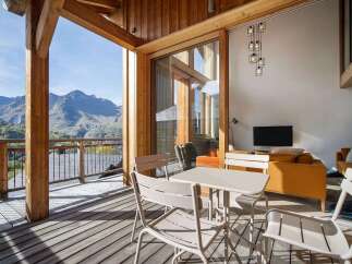 Experience breathtaking mountain views from this stunning balcony, perfect for enjoying your morning coffee or evening relaxation.