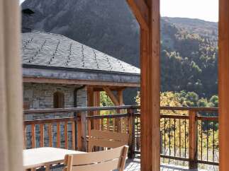 Experience breathtaking mountain views from this charming chalet's private balcony.