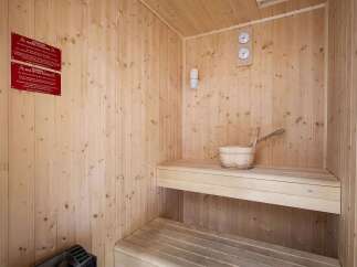 Experience ultimate relaxation in this beautifully crafted wooden sauna.