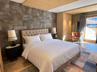 Experience luxurious mountain living in this beautifully appointed bedroom.