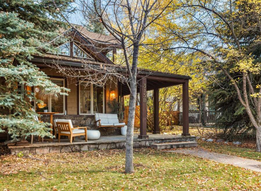 Charming home with a welcoming porch, perfect for enjoying crisp autumn days.