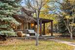 Charming home with a welcoming porch, perfect for enjoying crisp autumn days.
