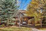 Charming home with a welcoming covered porch, perfect for enjoying the crisp autumn air.