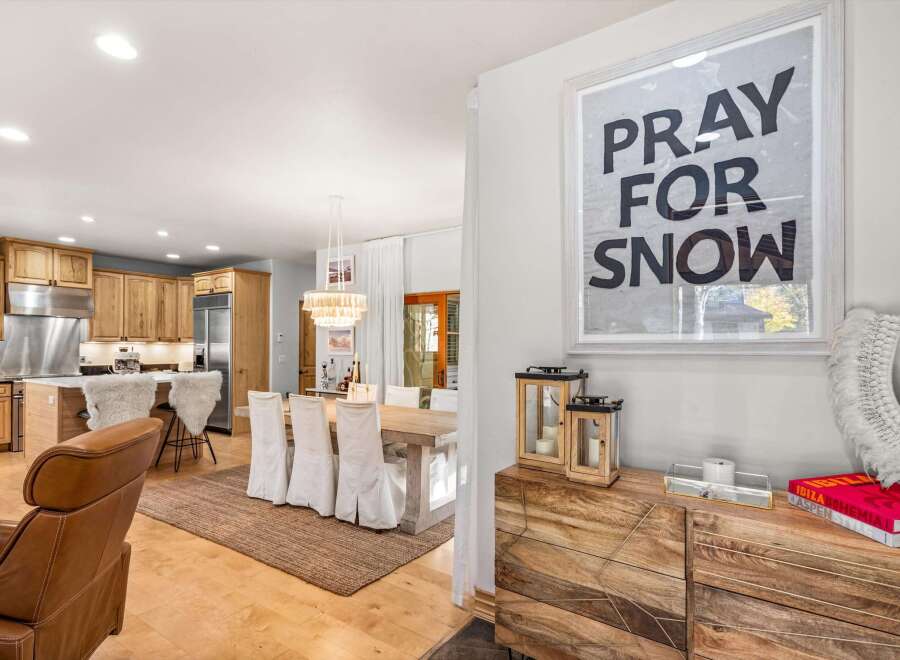 This open-concept living space seamlessly blends a modern kitchen with a cozy dining area, perfect for entertaining.