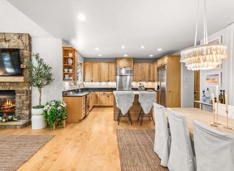 Experience the perfect blend of rustic charm and modern comfort in this inviting open-concept living and kitchen space.