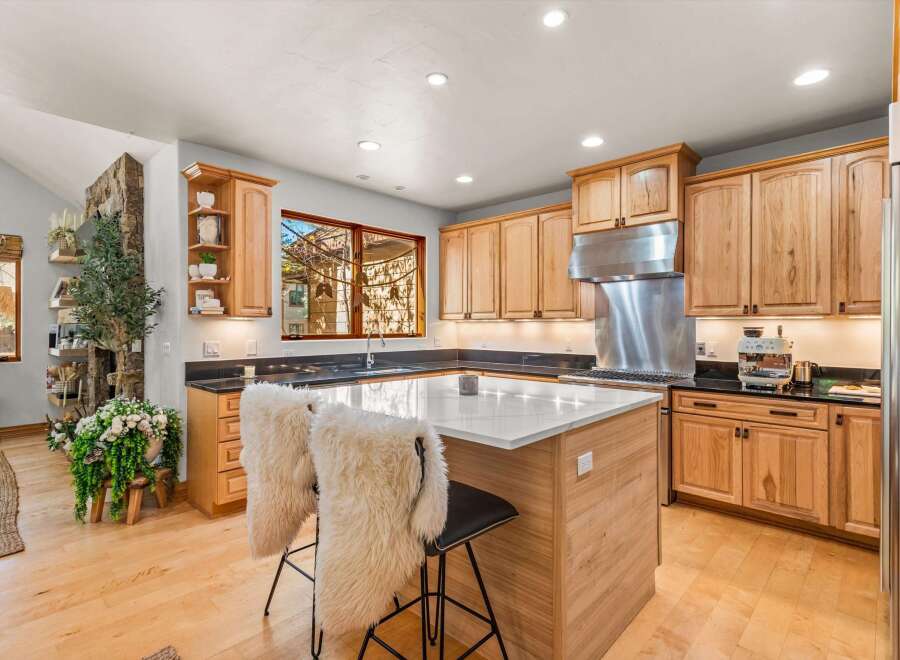 Experience culinary excellence in this beautifully appointed kitchen, featuring custom wood cabinetry and sleek granite countertops.