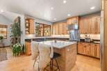 Experience culinary excellence in this beautifully appointed kitchen, featuring custom wood cabinetry and sleek granite countertops.