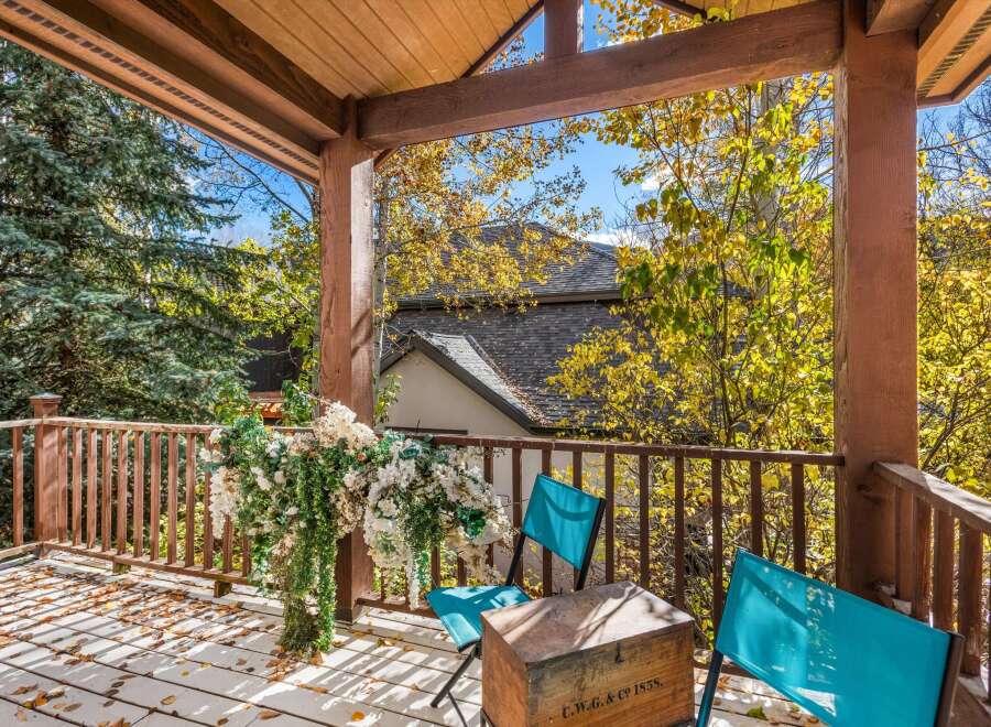 Enjoy the crisp autumn air from this charming covered porch, perfect for savoring your morning coffee or evening tea.